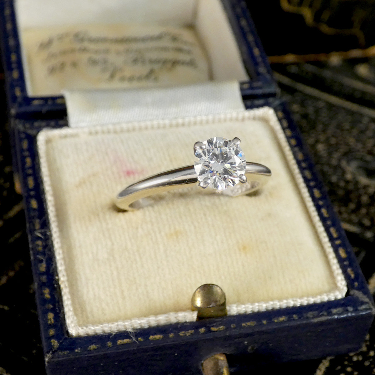 A diamond solitaire high set ring in white gold in a box