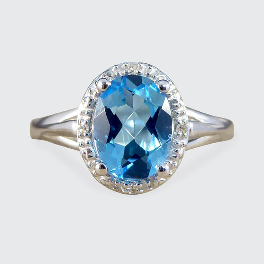 Oval Blue Topaz and Diamond Illusion Halo Cluster Ring in White Gold - Wharfedale Antiques