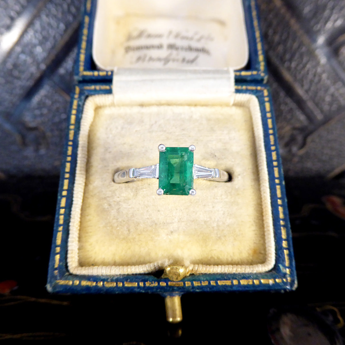 1.03ct Emerald Cut Emerald Ring with Tapered Baguette Cut Diamond Shoulders in Platinum - Wharfedale Antiques