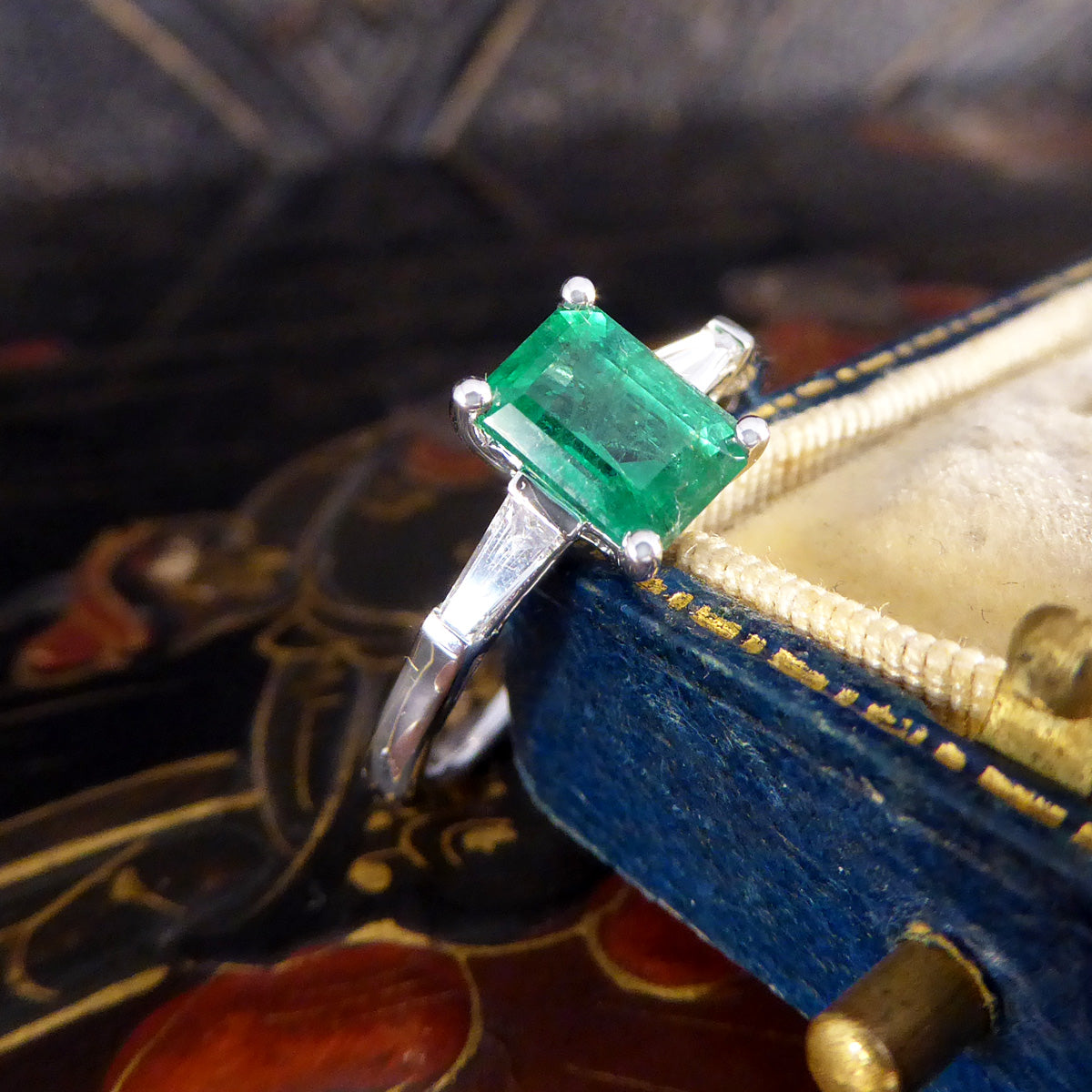 1.03ct Emerald Cut Emerald Ring with Tapered Baguette Cut Diamond Shoulders in Platinum - Wharfedale Antiques